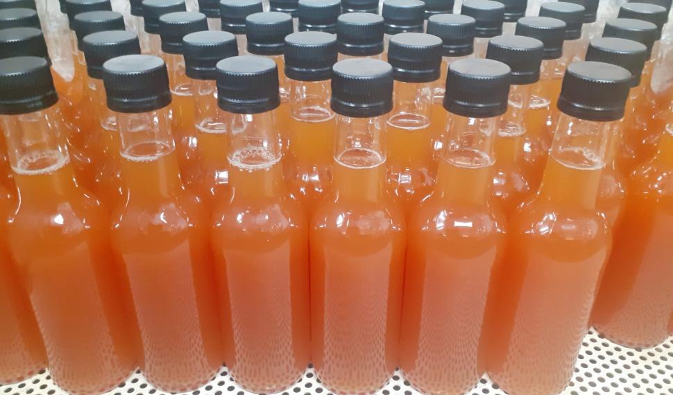 Juice bottles ready to be labelled