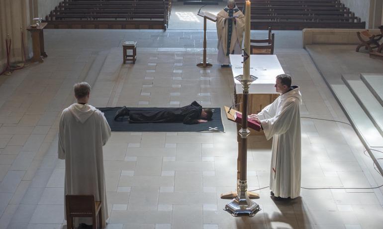 Br Joseph Benedict prostrate on the pall